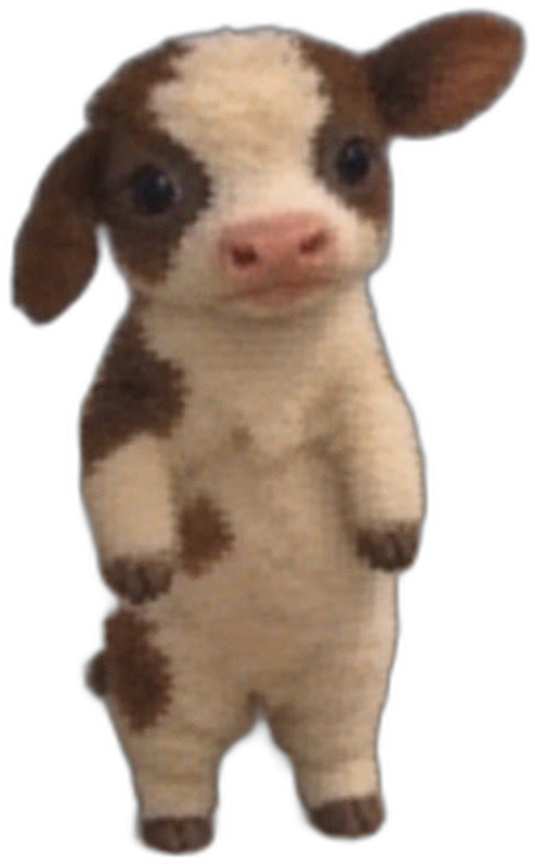 binky, a small brown-and-white cow standing upright
